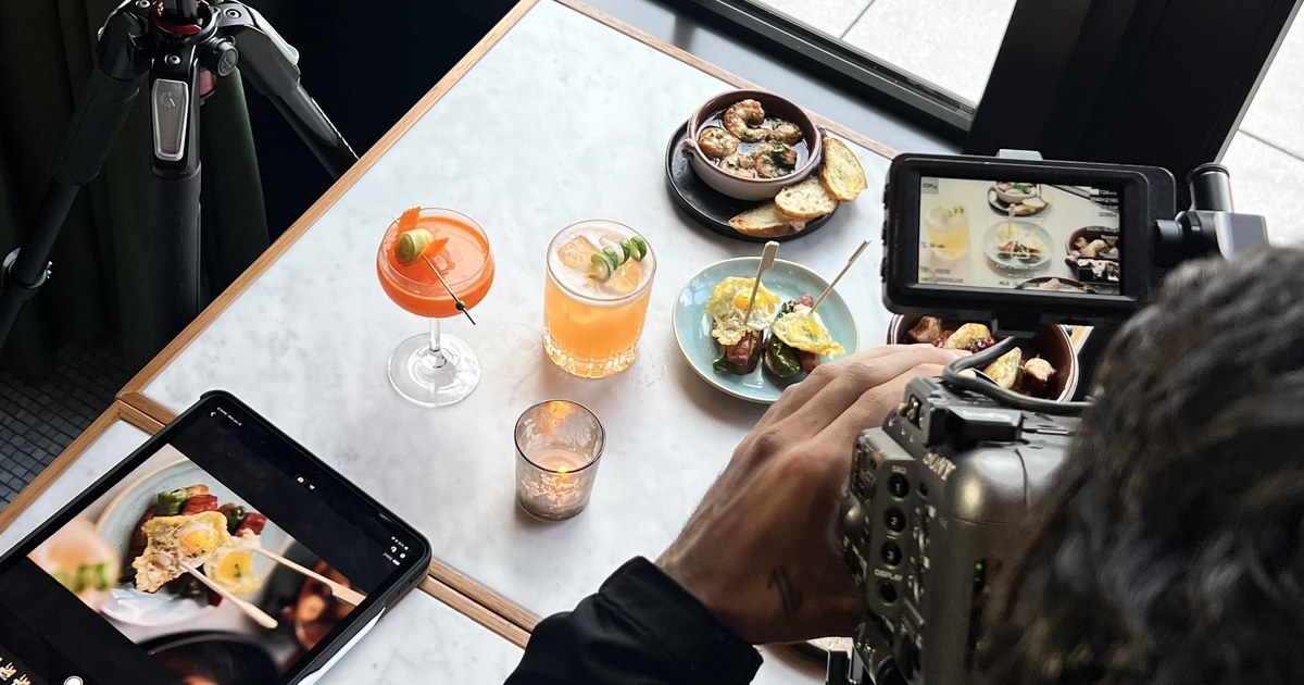 Los Films camera filming cocktails and small plates on a restaurant table in Detroit